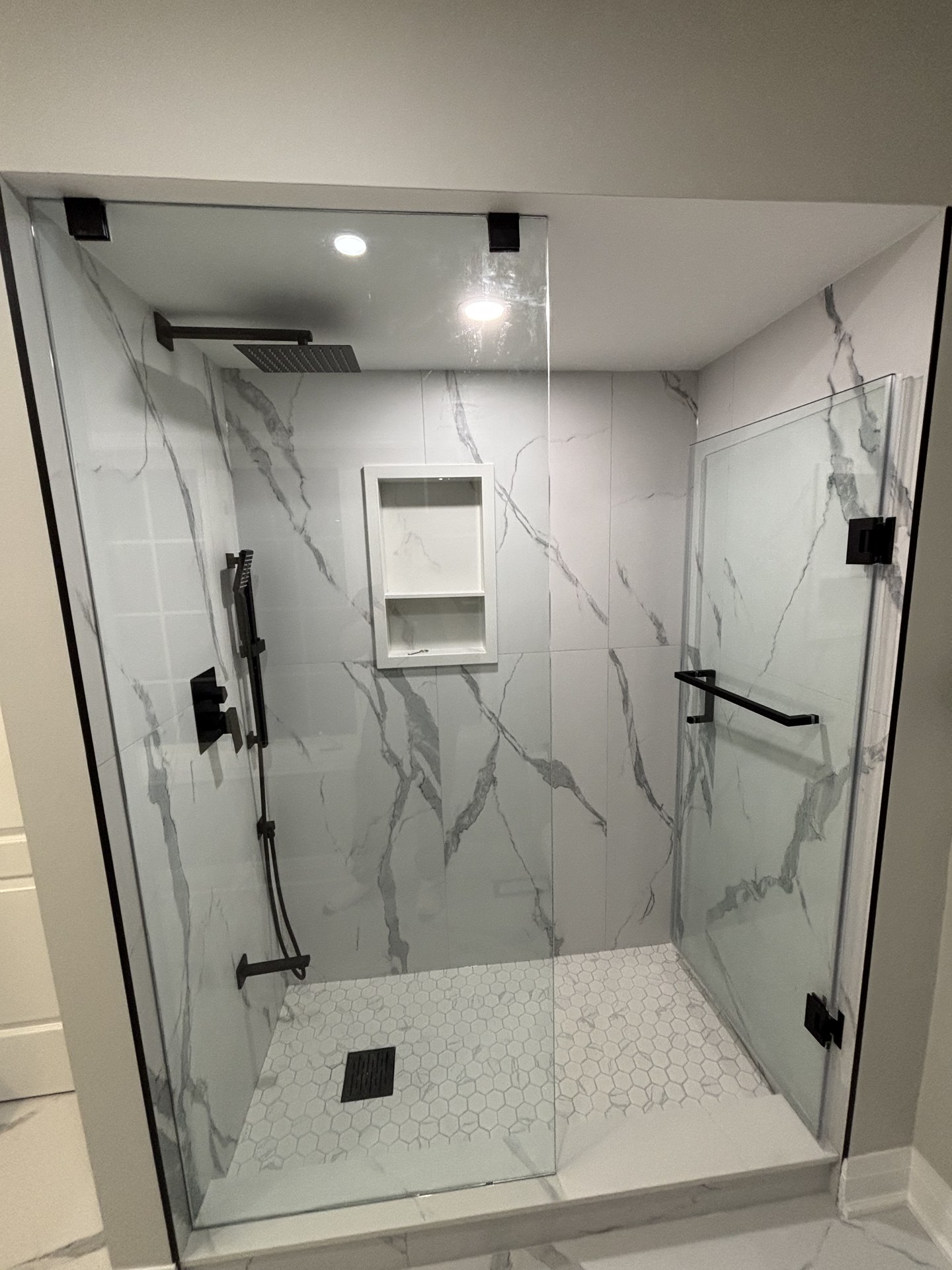 Modern soaking tub and brass fixture detail